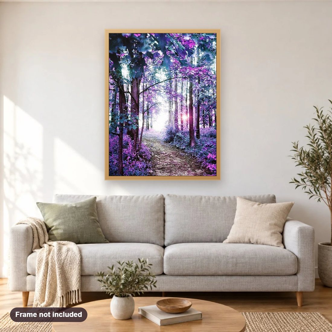 A Forest Pathway diamond painting shown framed on a living room wall above a sofa