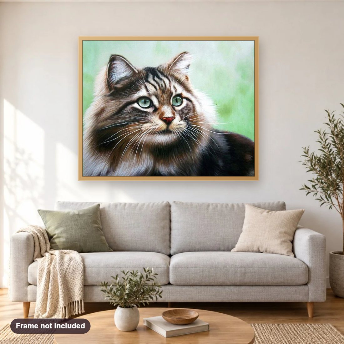 Adorable Cat diamond painting shown framed on a living room wall above a sofa