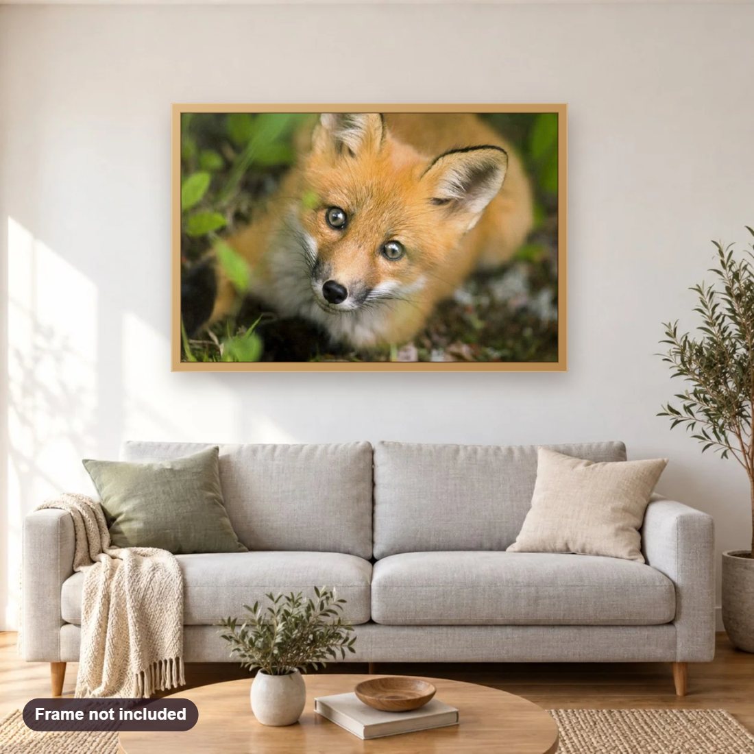 Adorable Fox diamond painting shown framed on a living room wall above a sofa