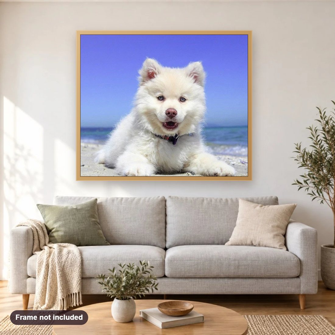 Adorable Puppy on the Beach diamond painting shown framed on a living room wall above a sofa