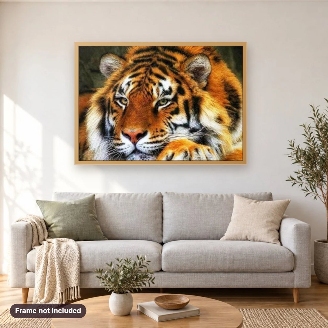 Adorable Tiger diamond painting shown framed on a living room wall above a sofa