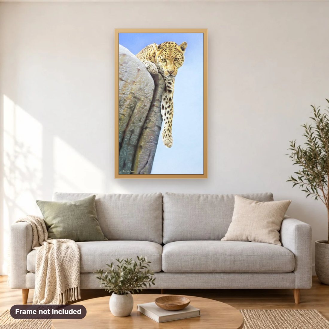 African Leopard diamond painting shown framed on a living room wall above a sofa