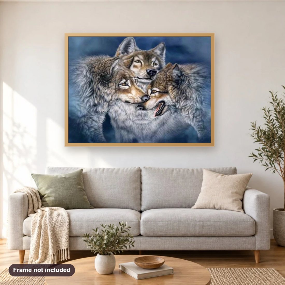 Alaskan Tundra wolves diamond painting shown framed on a living room wall above a sofa