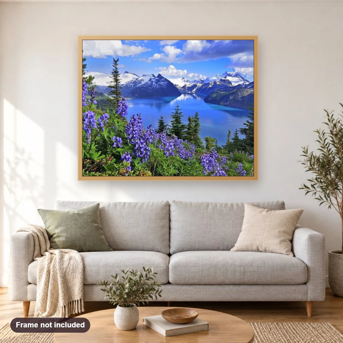 Amazing Mountains View & Blue Flowers diamond painting shown framed on a living room wall above a sofa