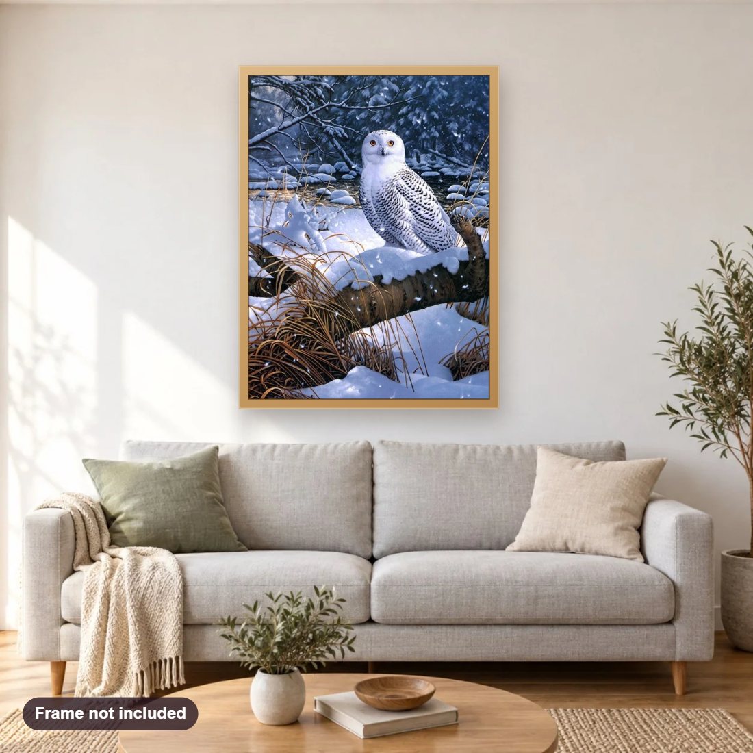 Amazing Snow Owl diamond painting shown framed on a living room wall above a sofa