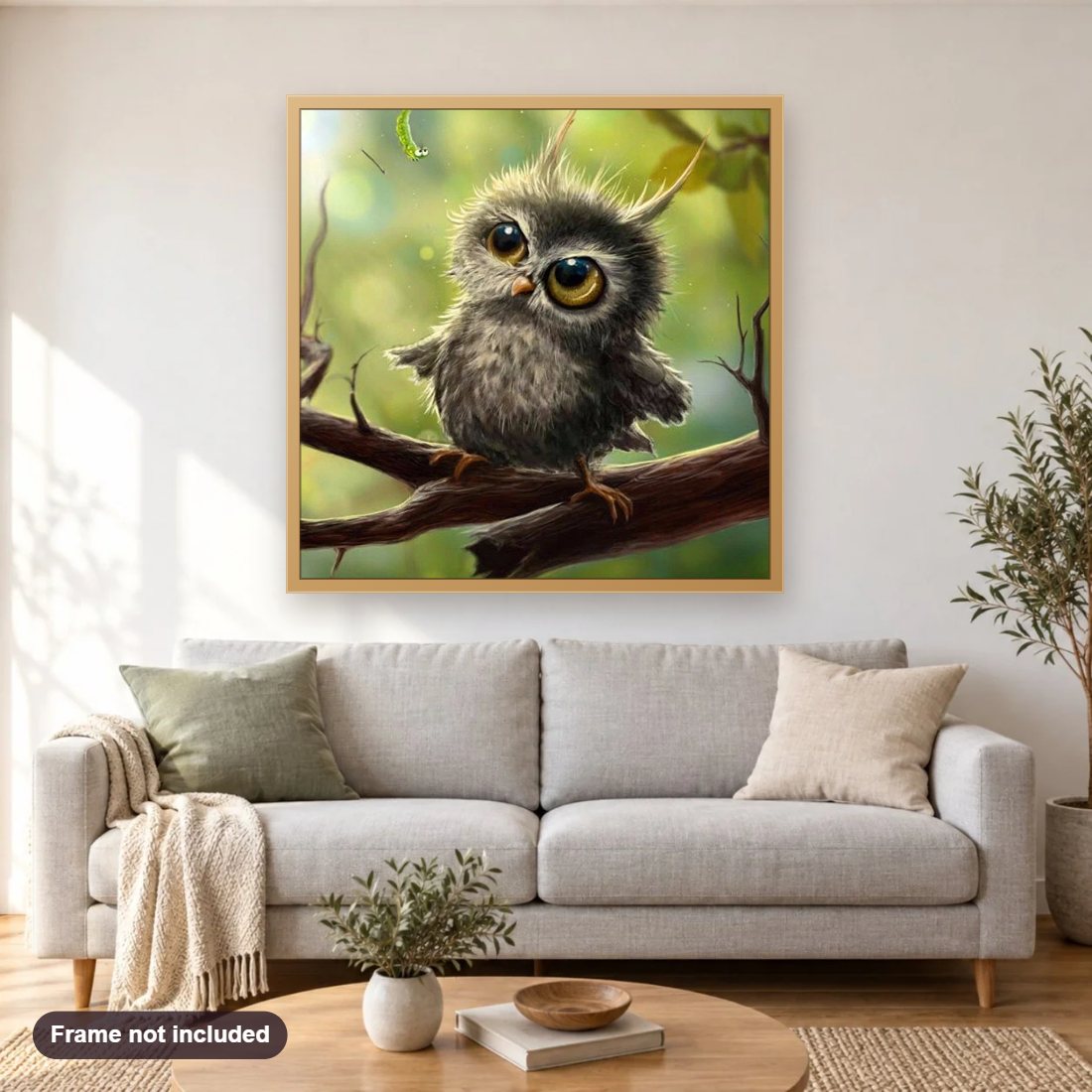 An Owl Starring Caterpillar diamond painting shown framed on a living room wall above a sofa