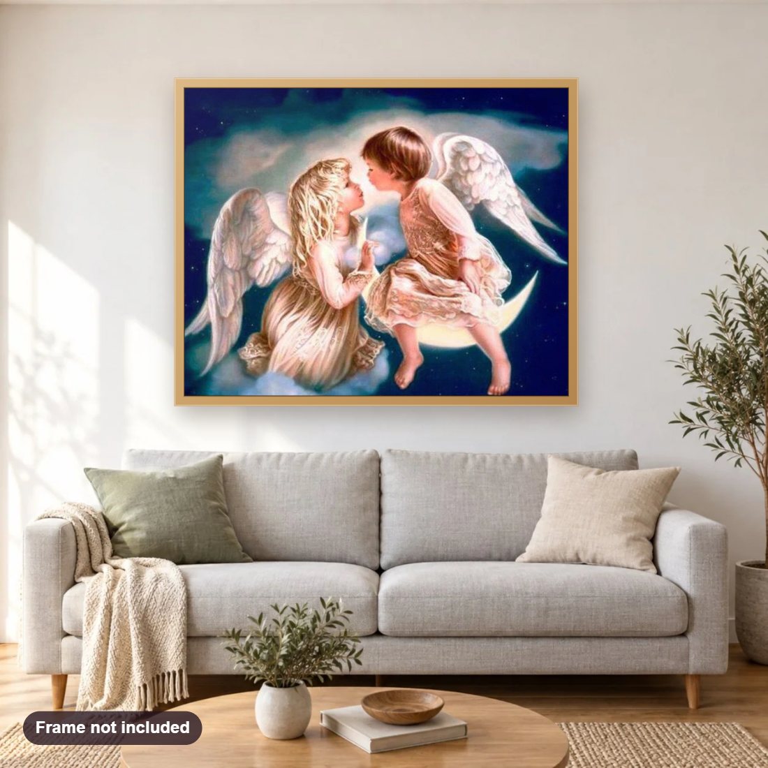 Angel Kiss diamond painting shown framed on a living room wall above a sofa
