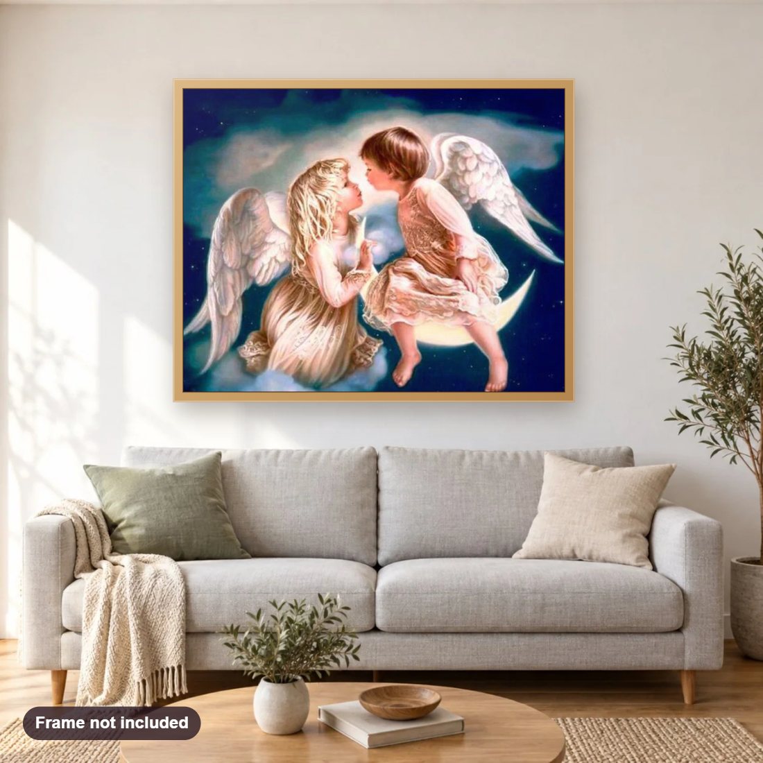 Angel Kiss on Moon diamond painting shown framed on a living room wall above a sofa