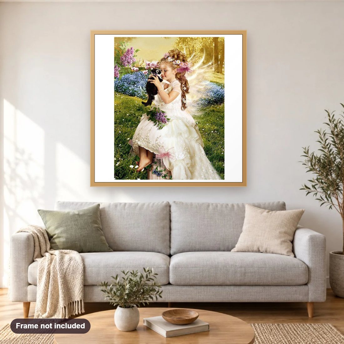 Angel with Her Kitten diamond painting shown framed on a living room wall above a sofa