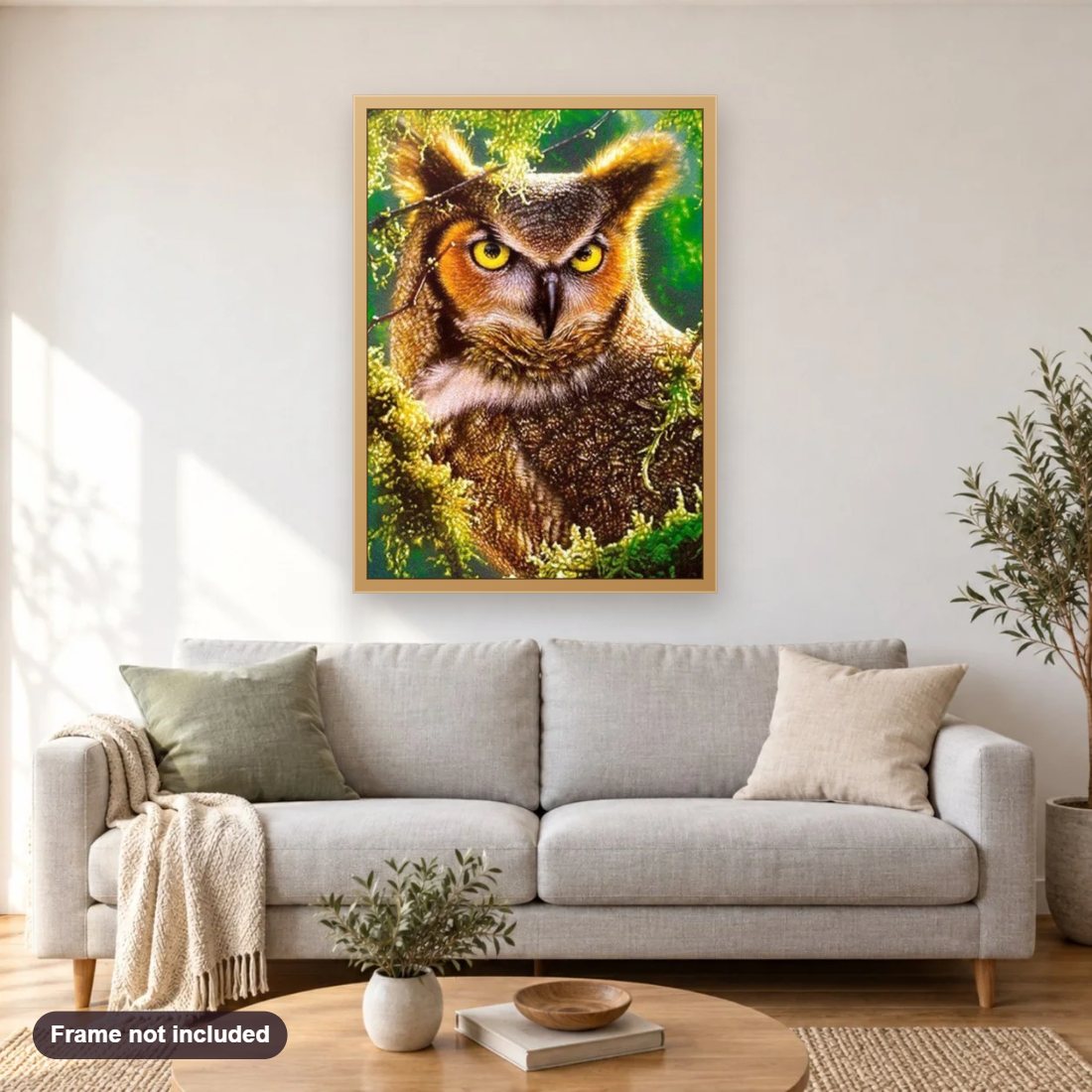 Angry Horned Owl diamond painting shown framed on a living room wall above a sofa