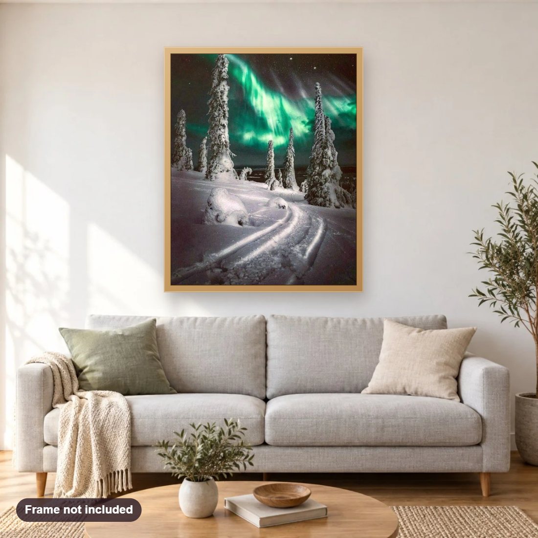 Aurora Snow Winter diamond painting shown framed on a living room wall above a sofa