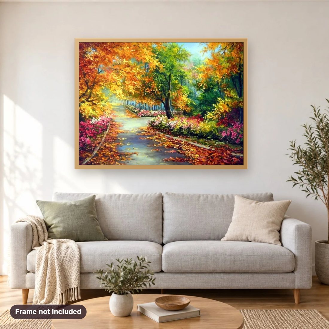 Autumn Pathway diamond painting shown framed on a living room wall above a sofa