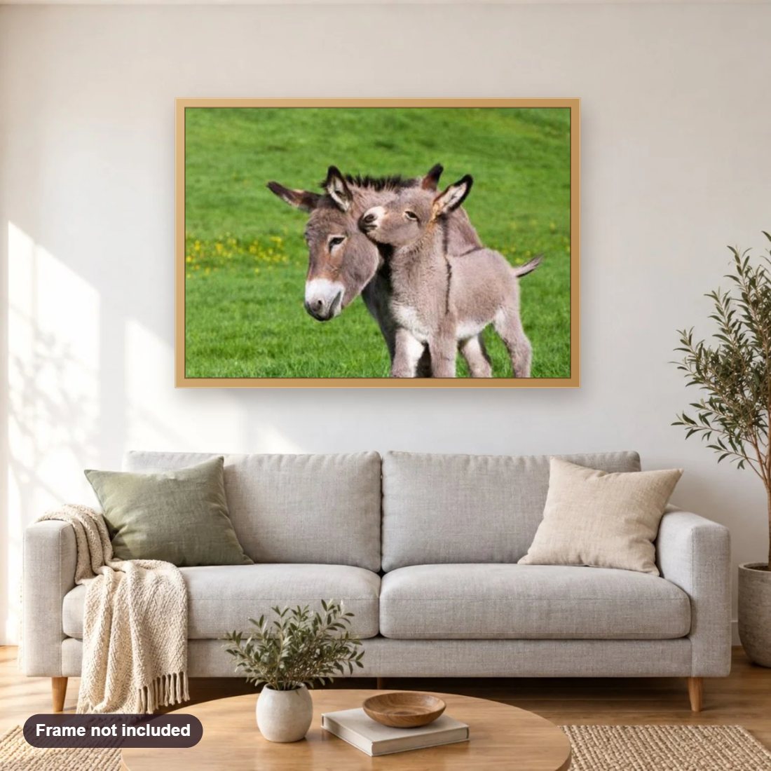 Baby Donkey with Mother diamond painting shown framed on a living room wall above a sofa