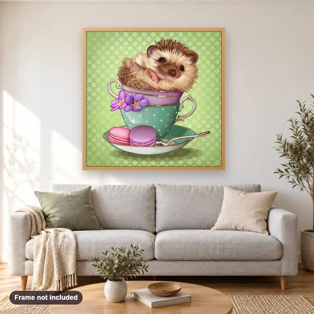 Baby Hedgehog in a Cup diamond painting shown framed on a living room wall above a sofa