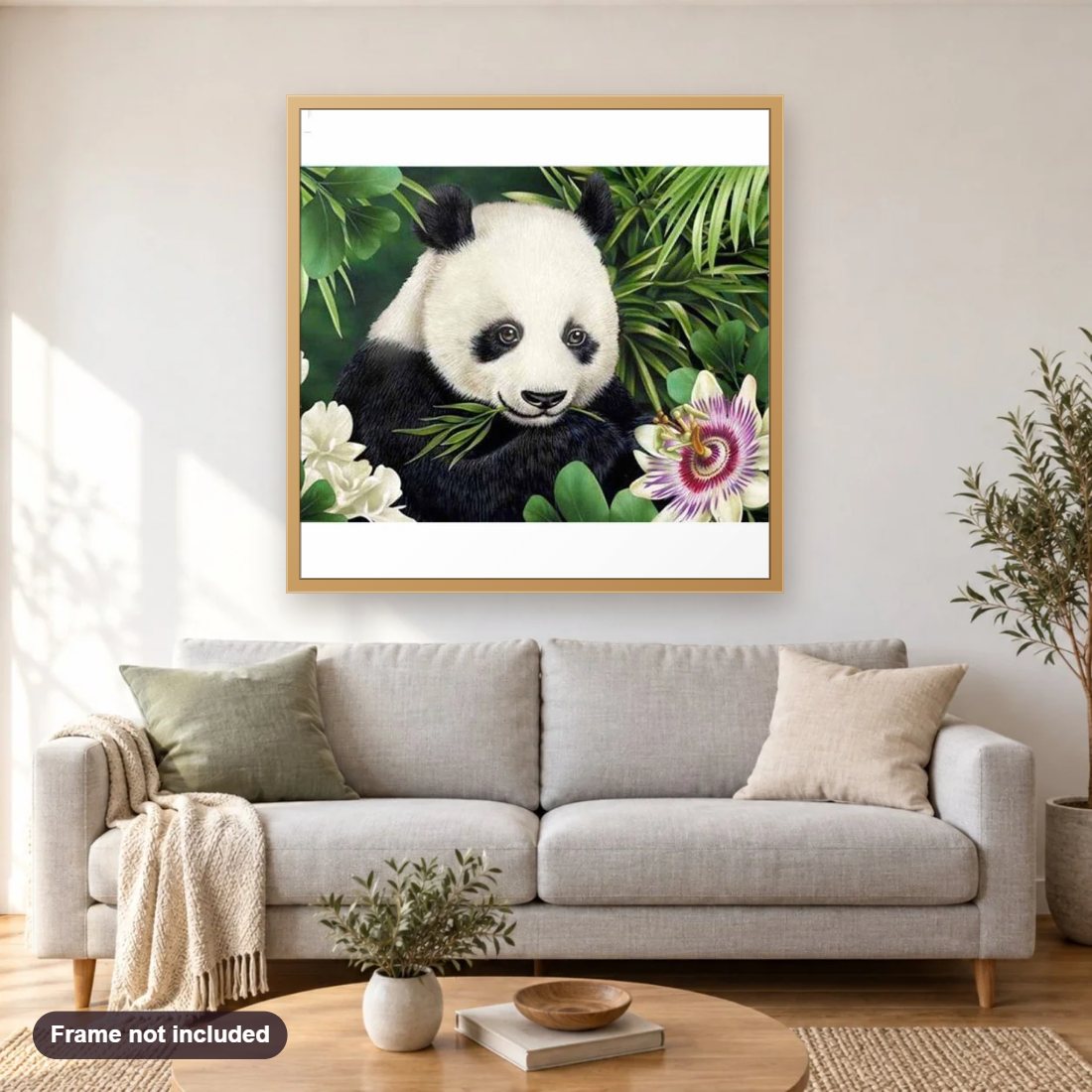 Baby Panda diamond painting shown framed on a living room wall above a sofa