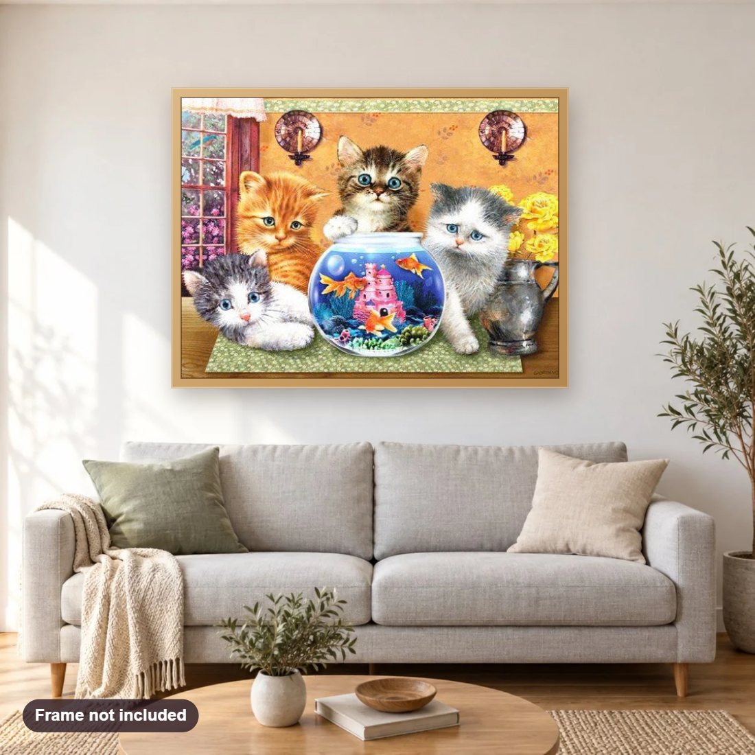 Cats & Fish diamond painting shown framed on a living room wall above a sofa