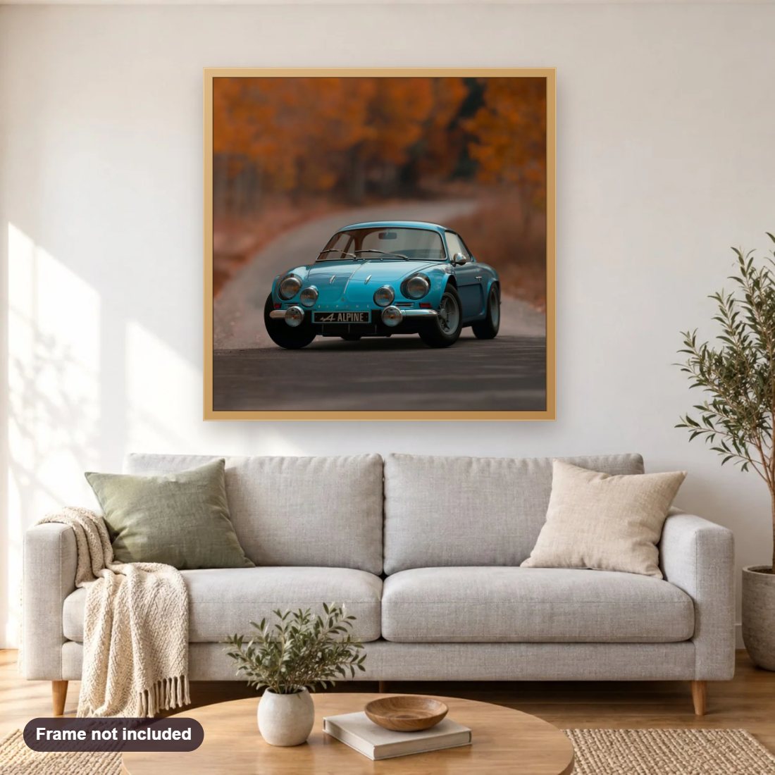 Beautiful Car diamond painting shown framed on a living room wall above a sofa