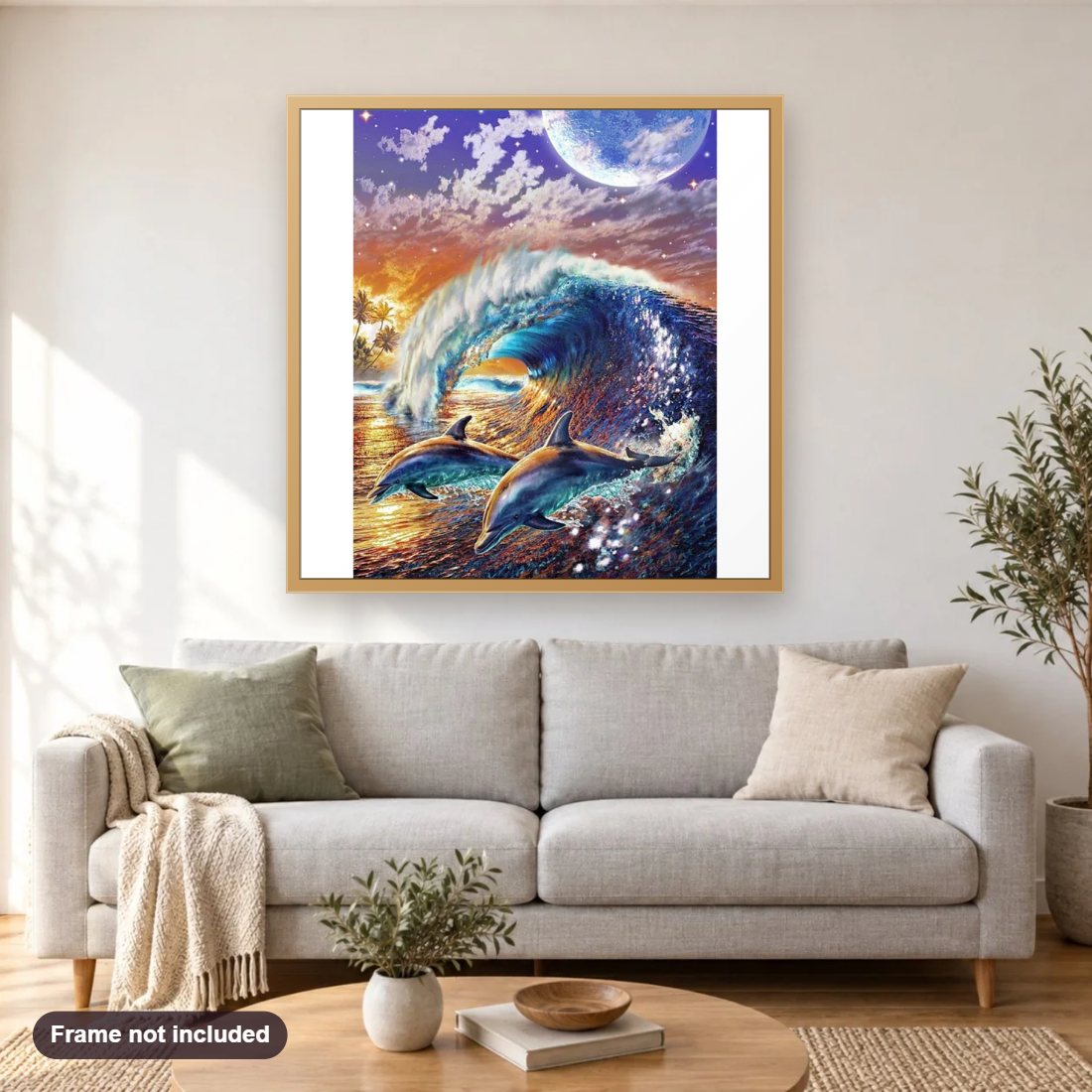 Beautiful Dolphins diamond painting shown framed on a living room wall above a sofa