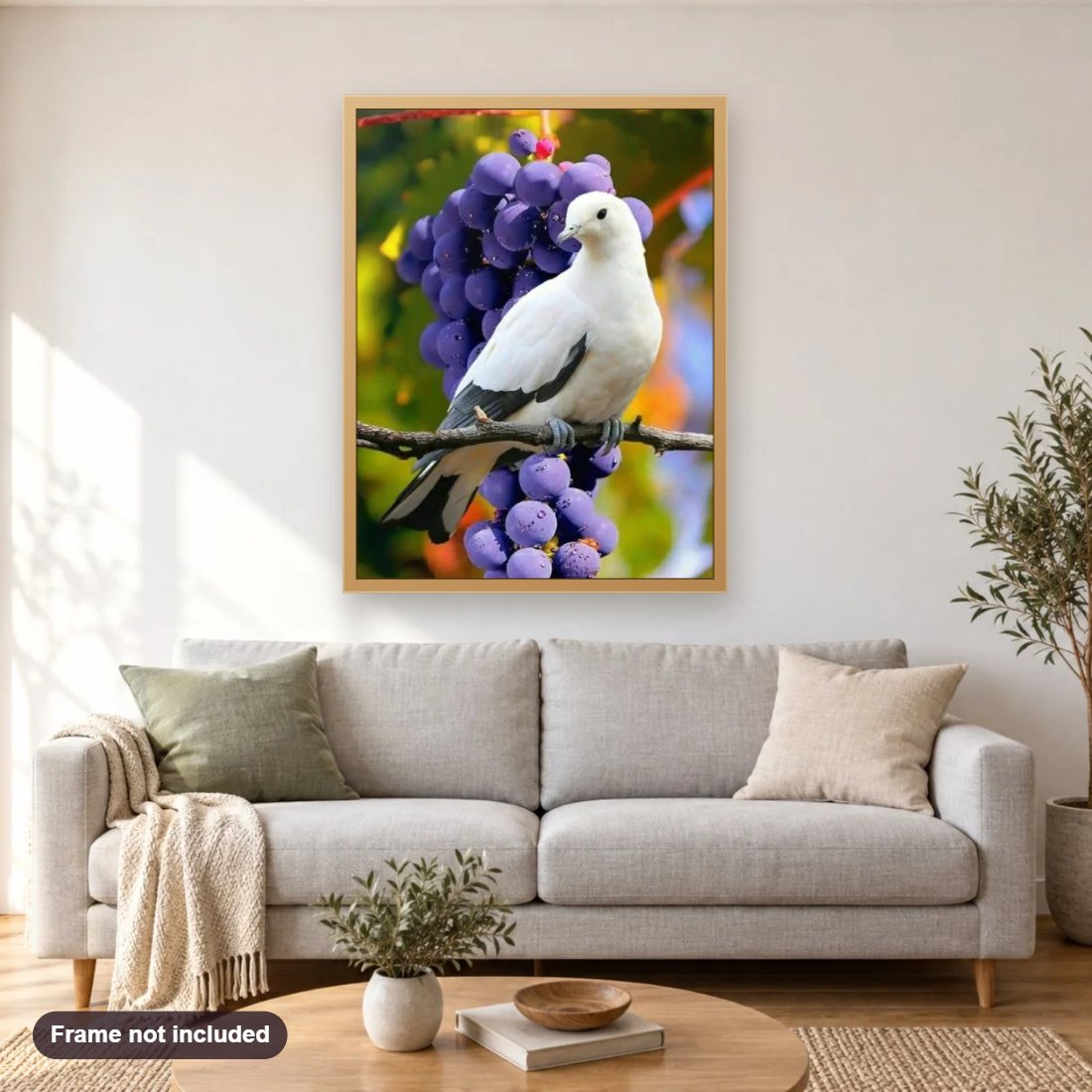 Beautiful Dove & Bunch of Grapes diamond painting shown framed on a living room wall above a sofa