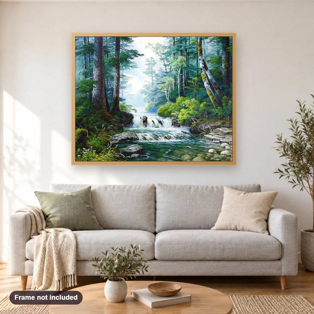 Beautiful Forest Waterfall diamond painting shown framed on a living room wall above a sofa