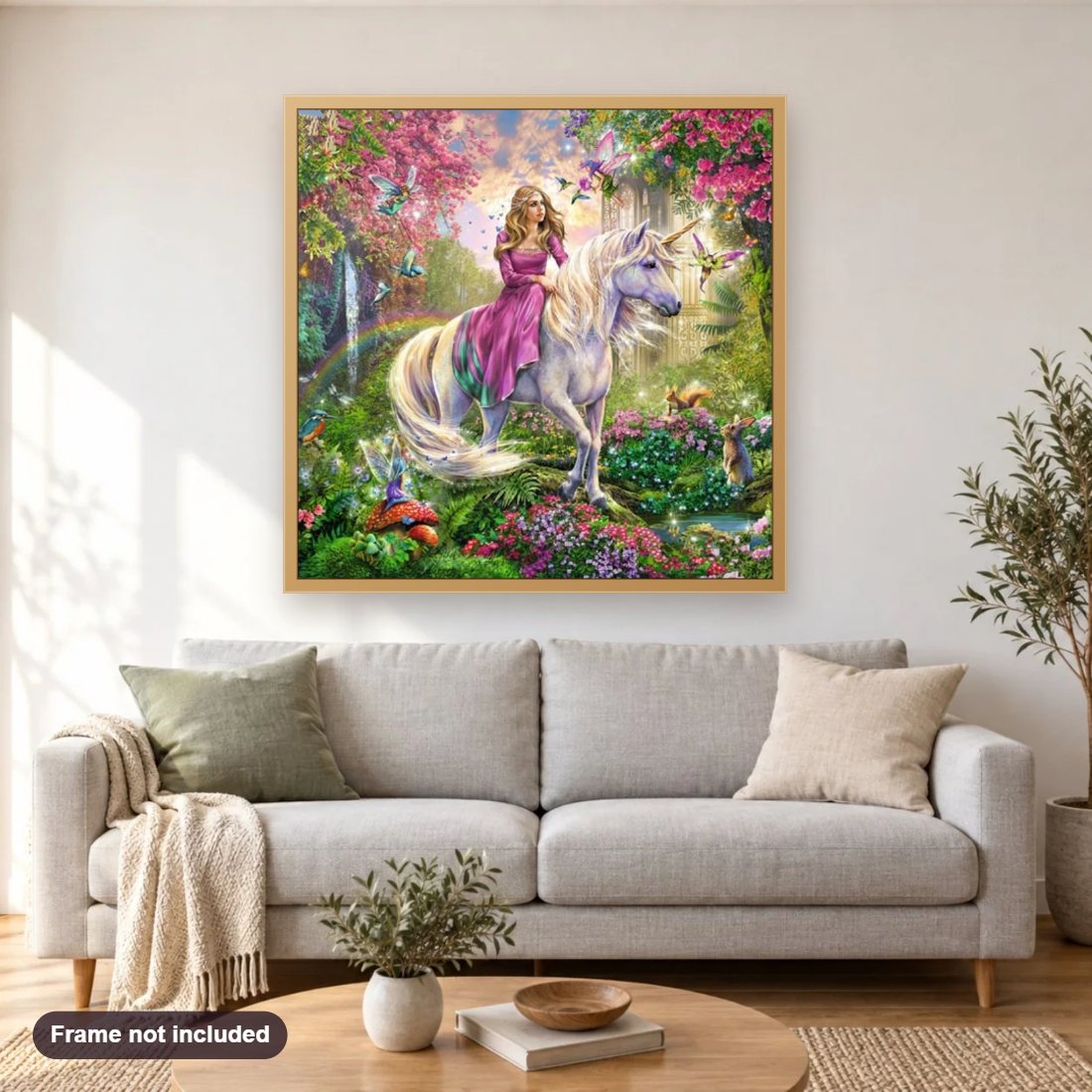 Beautiful Girl Riding the Unicorn diamond painting shown framed on a living room wall above a sofa