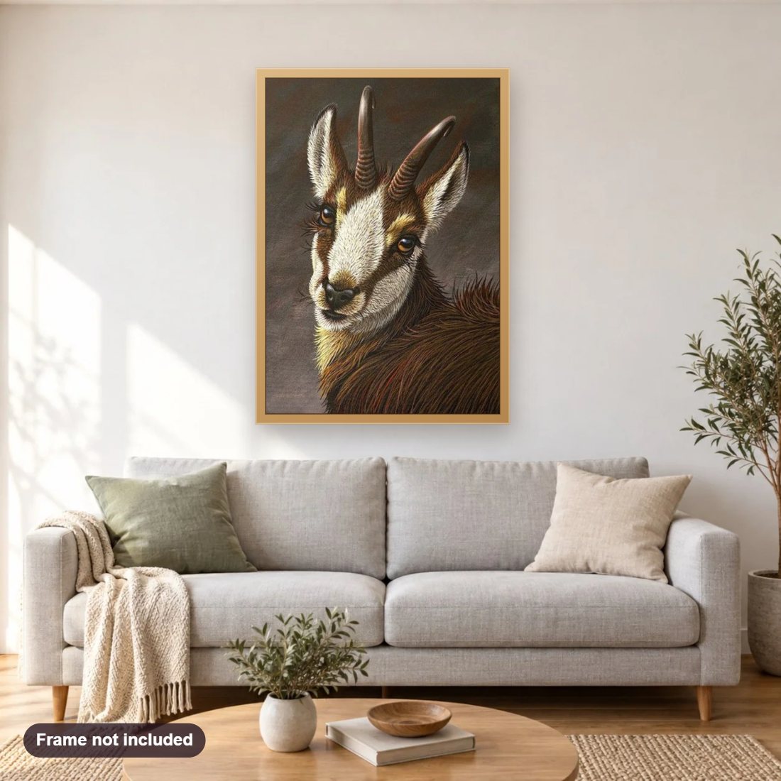 Beautiful Goat diamond painting shown framed on a living room wall above a sofa