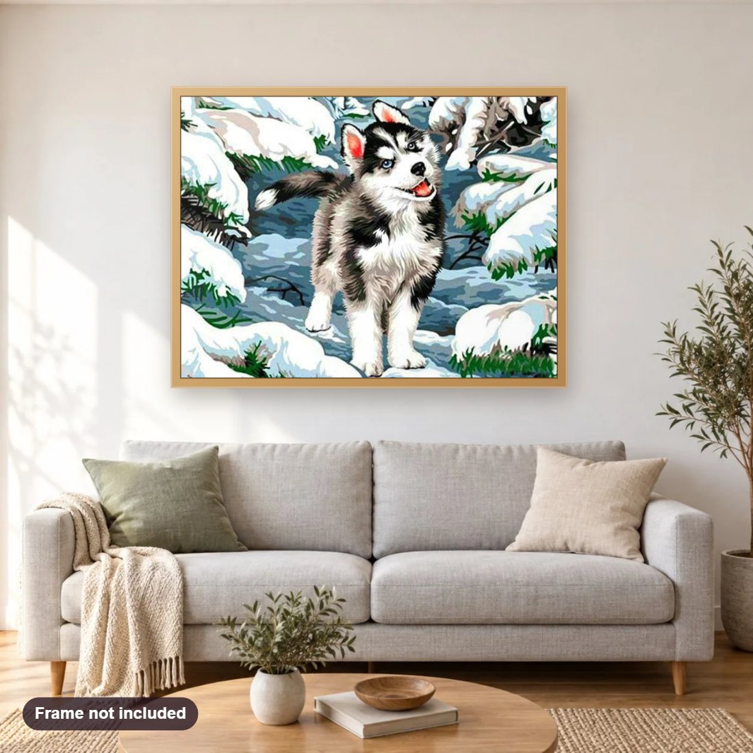 Beautiful Husky diamond painting shown framed on a living room wall above a sofa