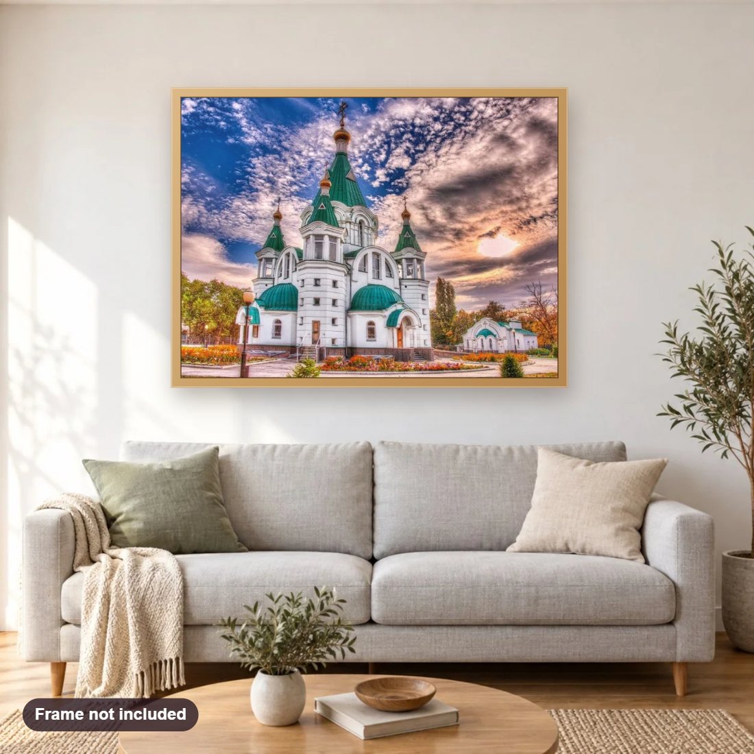 Beautiful Monastery diamond painting shown framed on a living room wall above a sofa