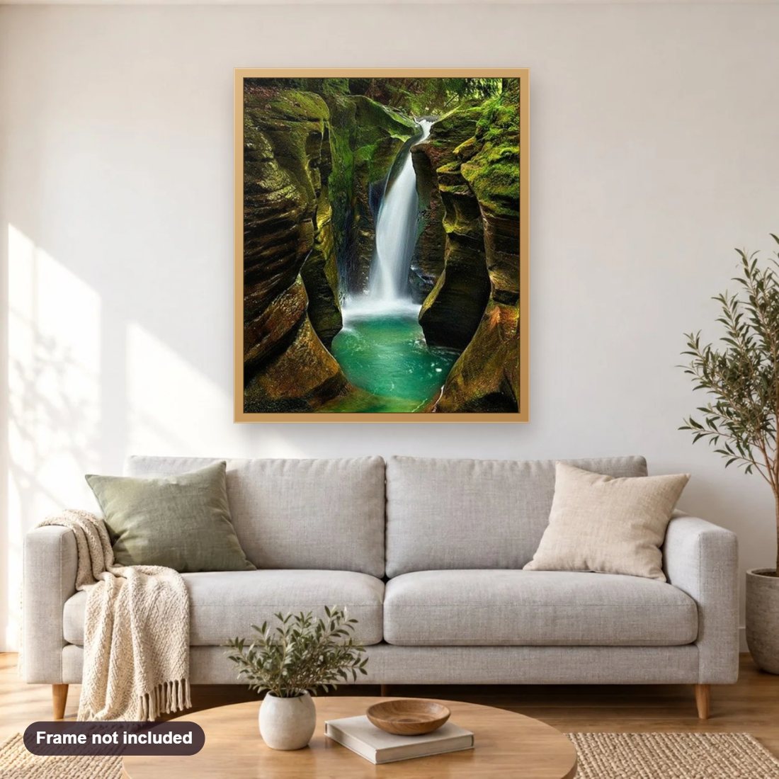 Beautiful Mountains Waterfall diamond painting shown framed on a living room wall above a sofa