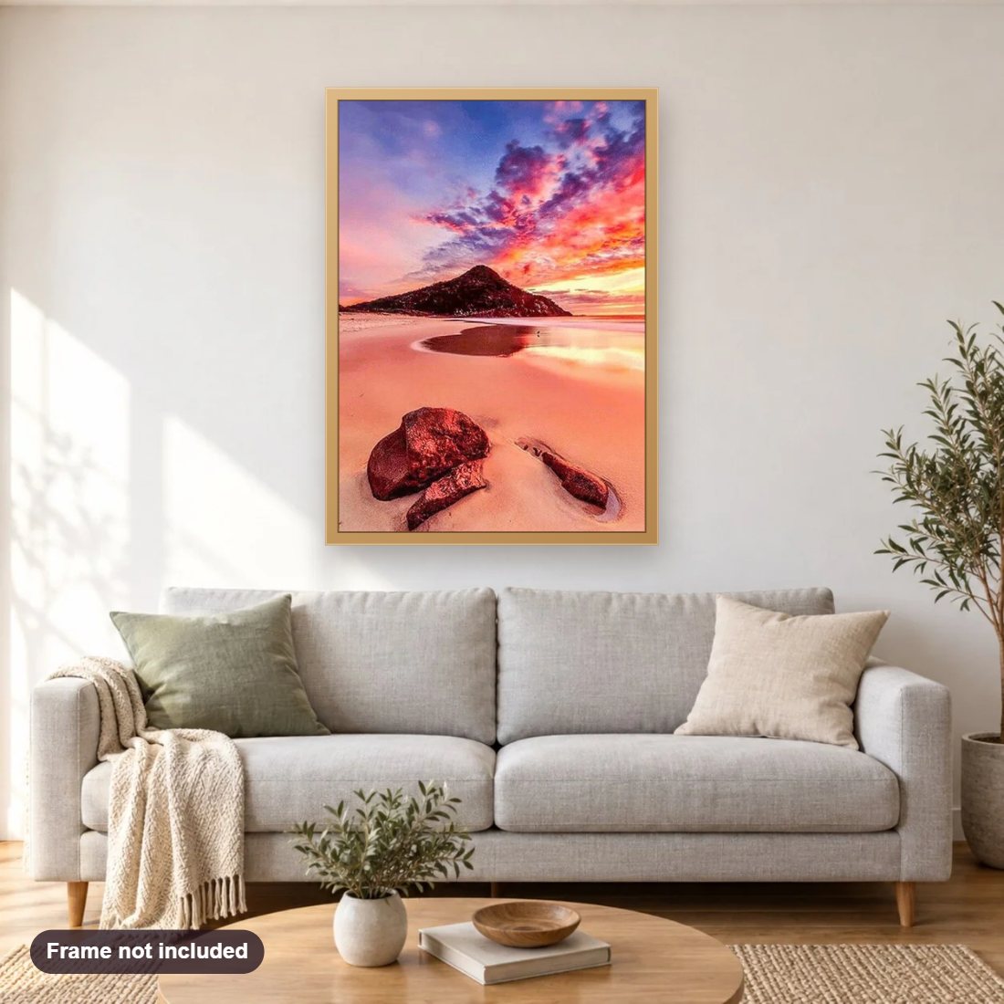 Beautiful Sky & Beach side Hill diamond painting shown framed on a living room wall above a sofa