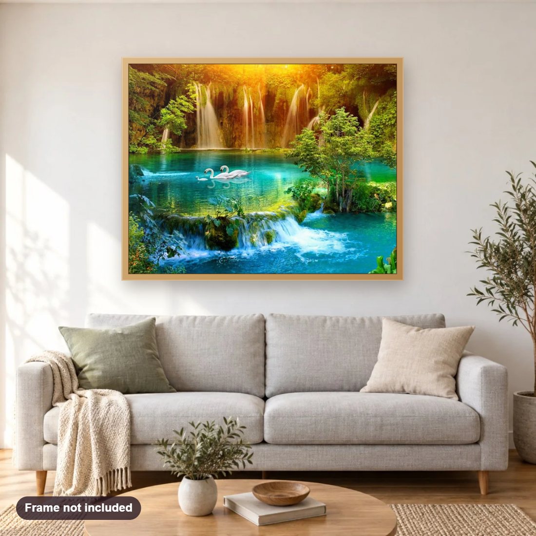 Beautiful Waterfall & Swans Family diamond painting shown framed on a living room wall above a sofa