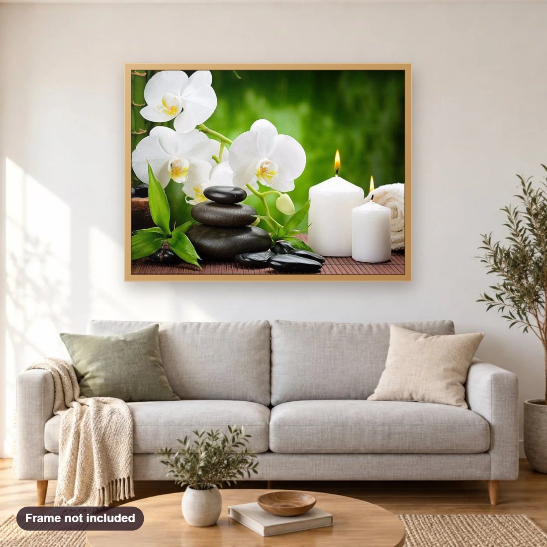 Beautiful White Flowers & Candles diamond painting shown framed on a living room wall above a sofa
