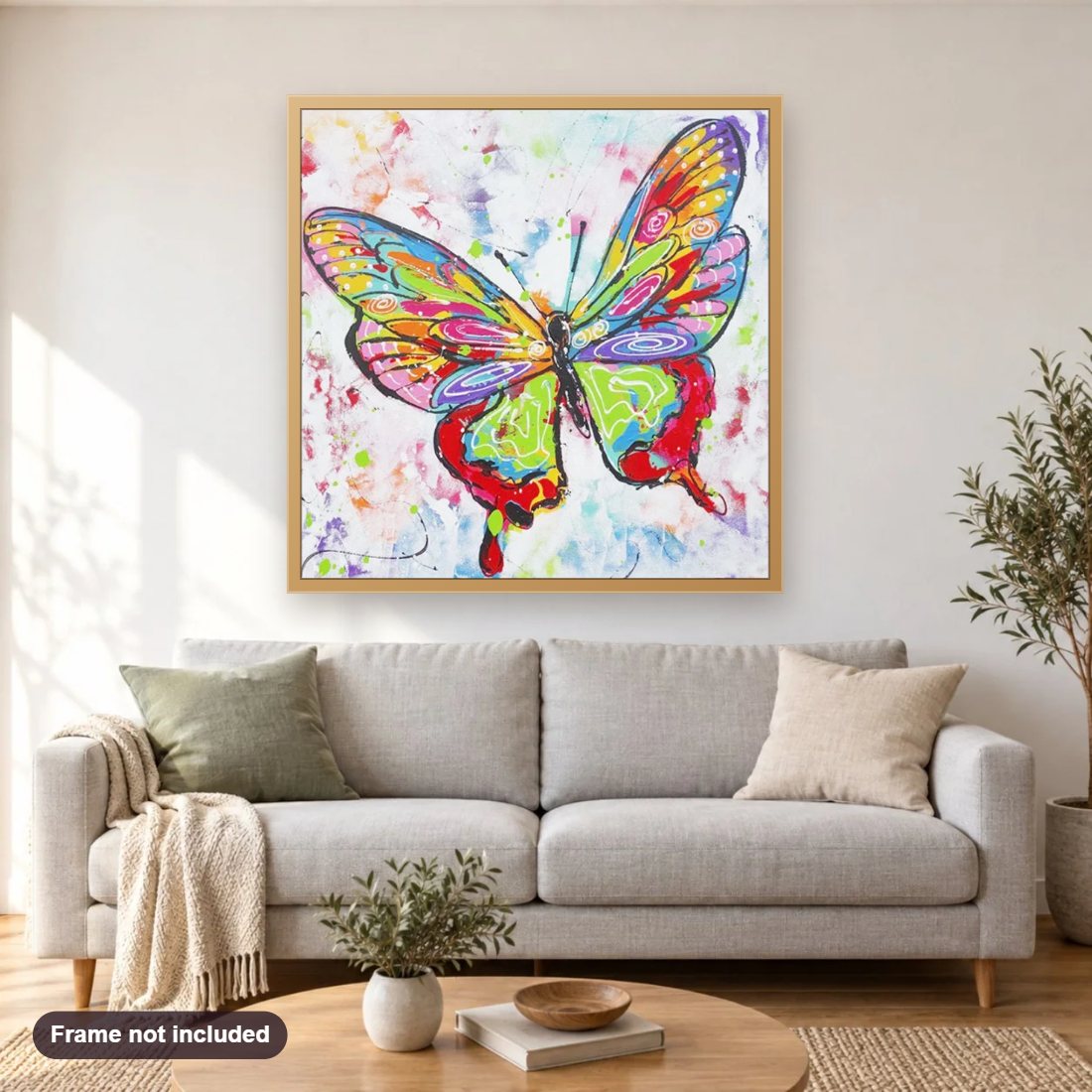 Beauty of Butterfly diamond painting shown framed on a living room wall above a sofa