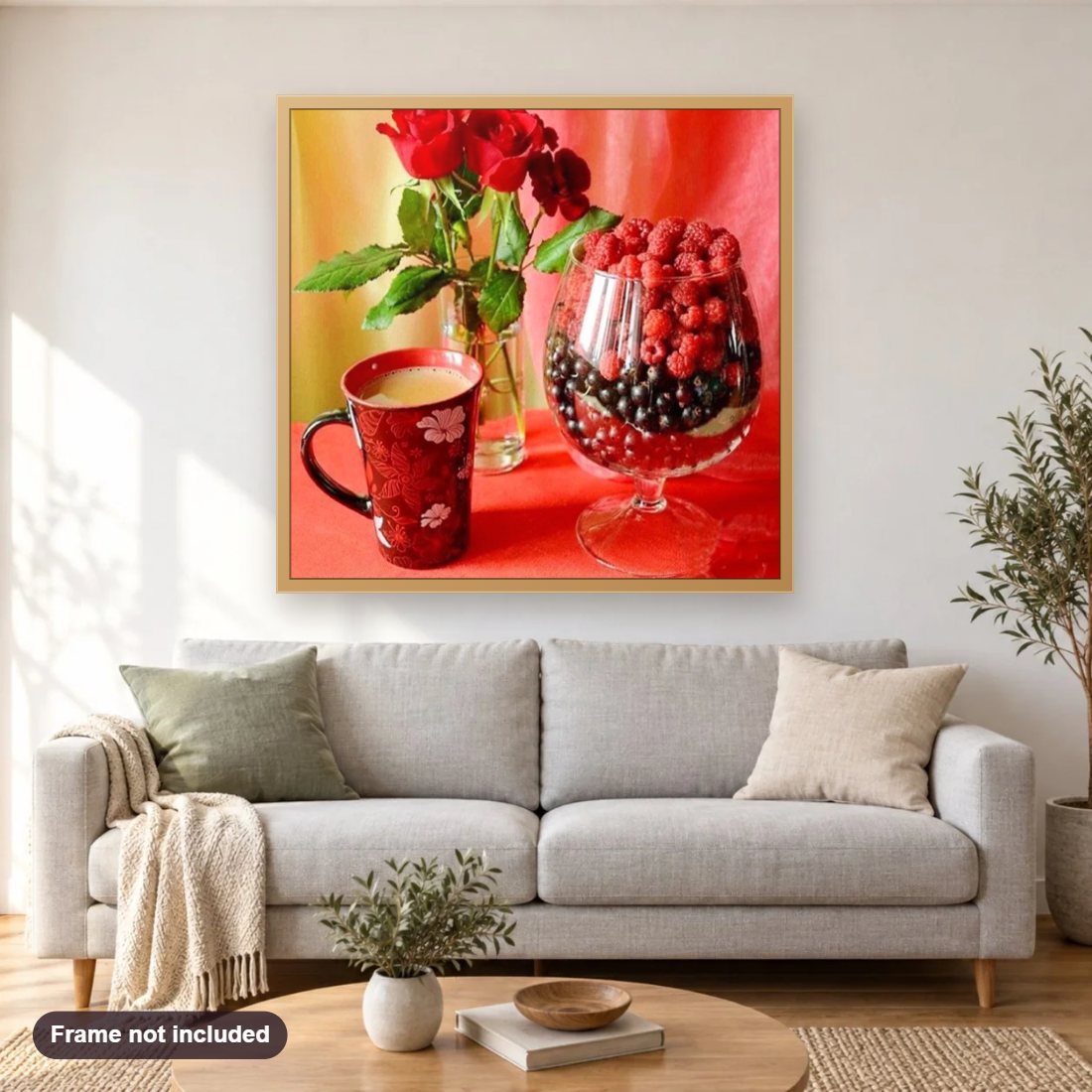 Berries & Morning Tea diamond painting shown framed on a living room wall above a sofa