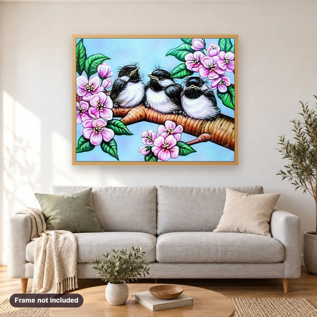 Birds Babies & Flowers diamond painting shown framed on a living room wall above a sofa