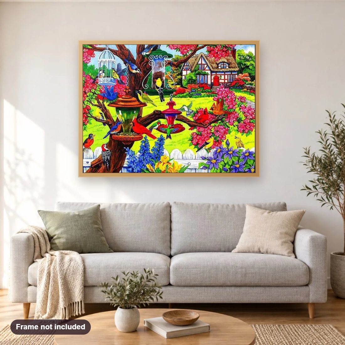 Birds Friendly Garden diamond painting shown framed on a living room wall above a sofa