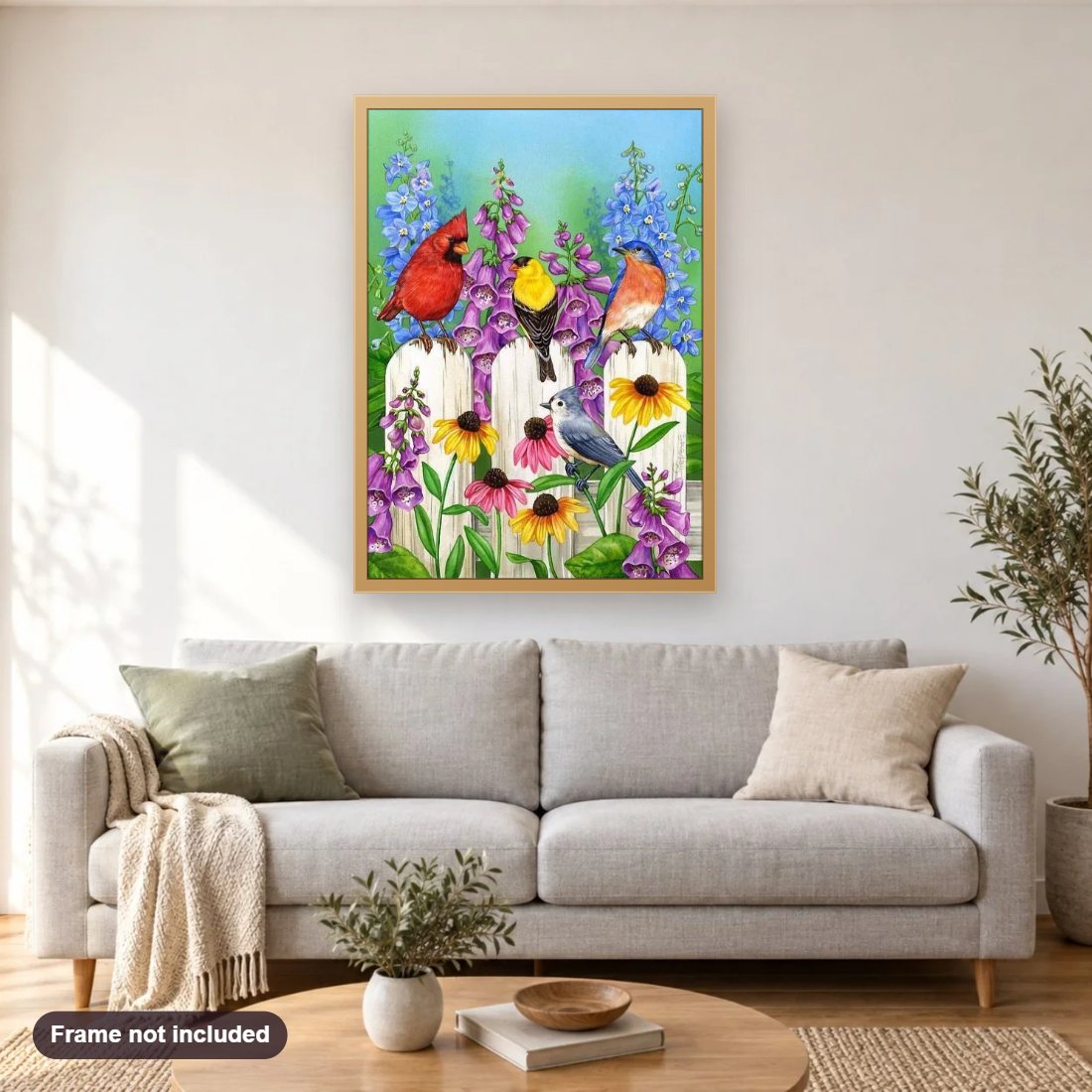 Birds In Garden diamond painting shown framed on a living room wall above a sofa