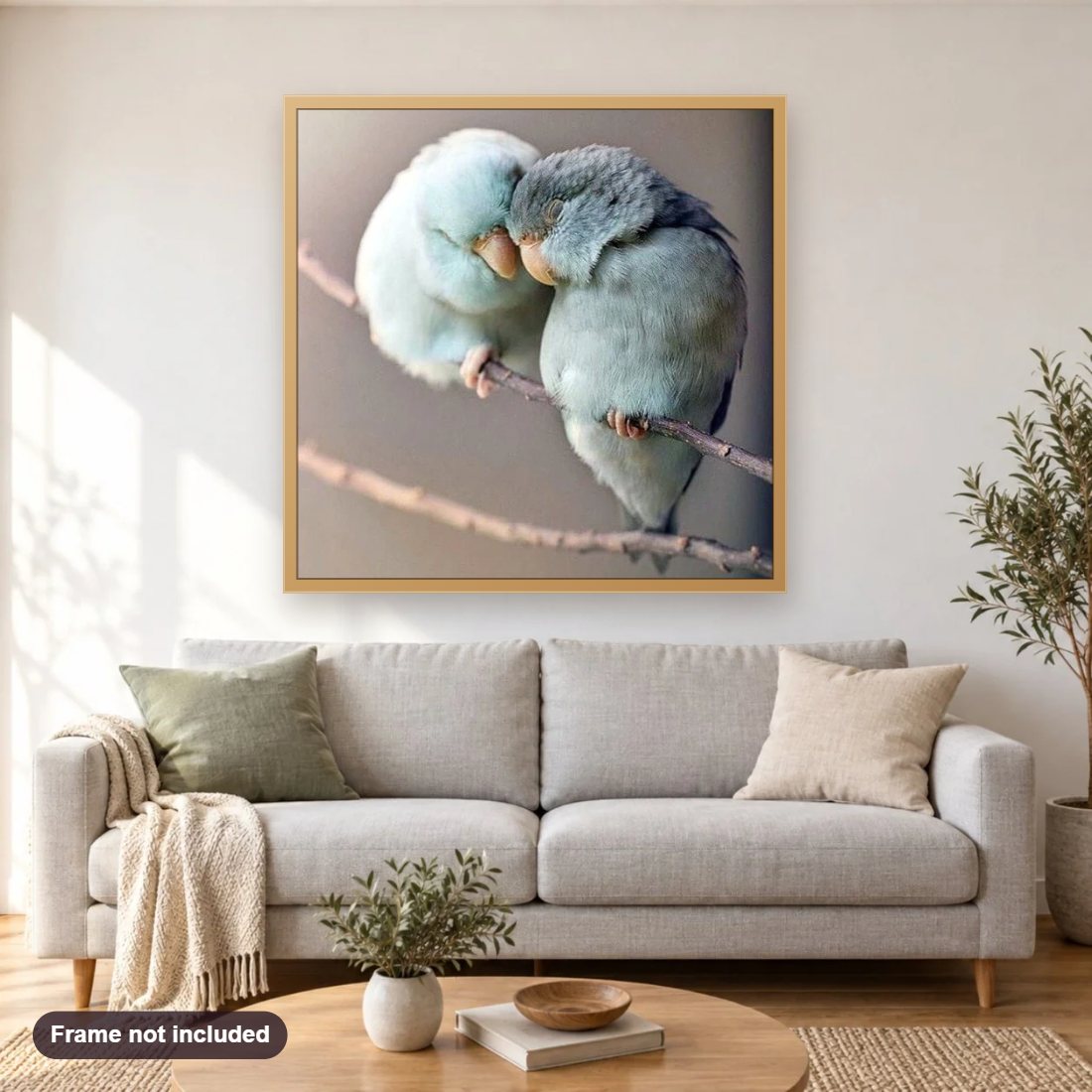 Birds in Love diamond painting shown framed on a living room wall above a sofa