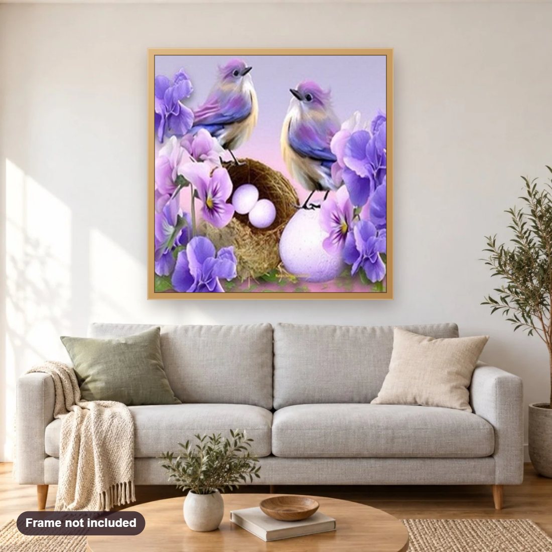 Birds Nest & Flowers diamond painting shown framed on a living room wall above a sofa