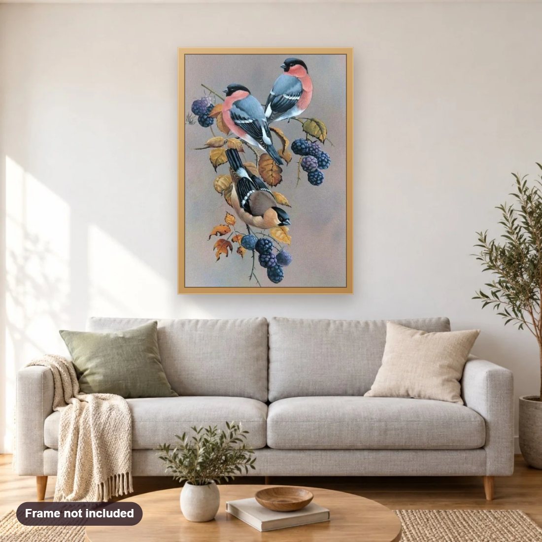 Birds on Berries Tree diamond painting shown framed on a living room wall above a sofa