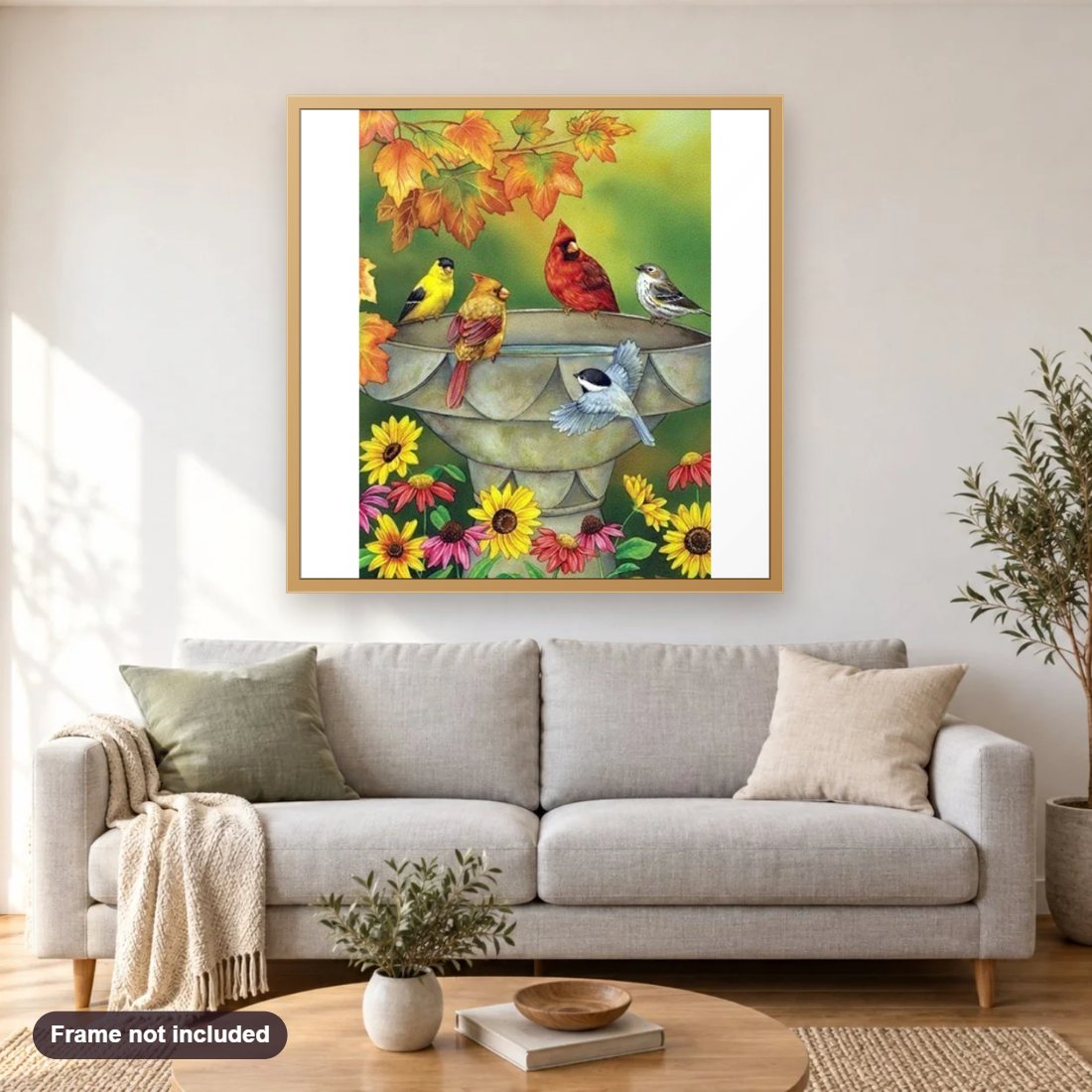 Birds On The Fountain diamond painting shown framed on a living room wall above a sofa