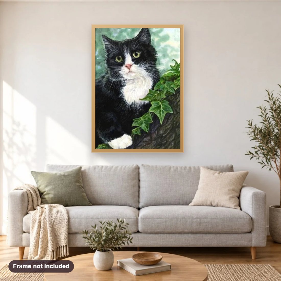Black Cat on Tree diamond painting shown framed on a living room wall above a sofa