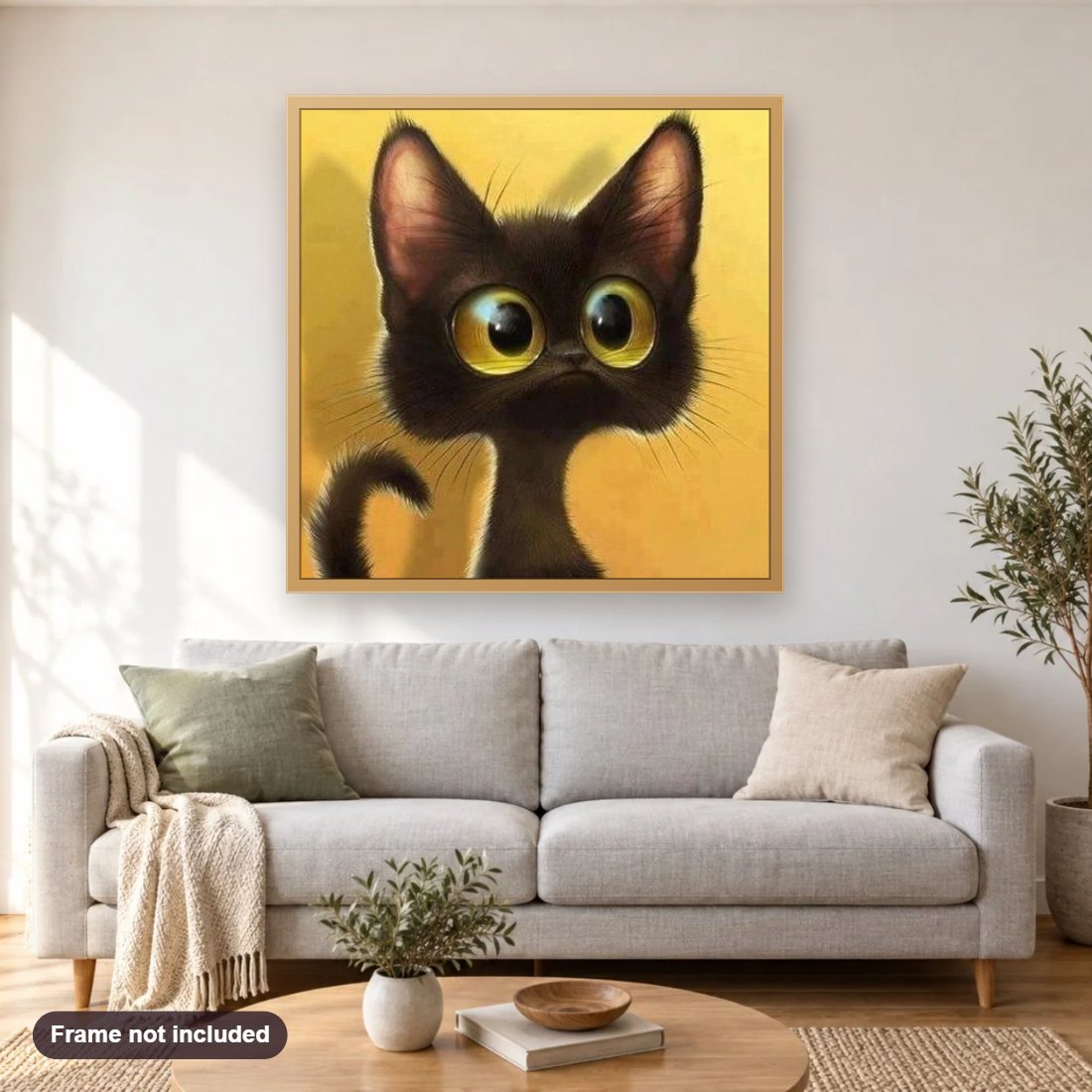 Black Kitten diamond painting shown framed on a living room wall above a sofa
