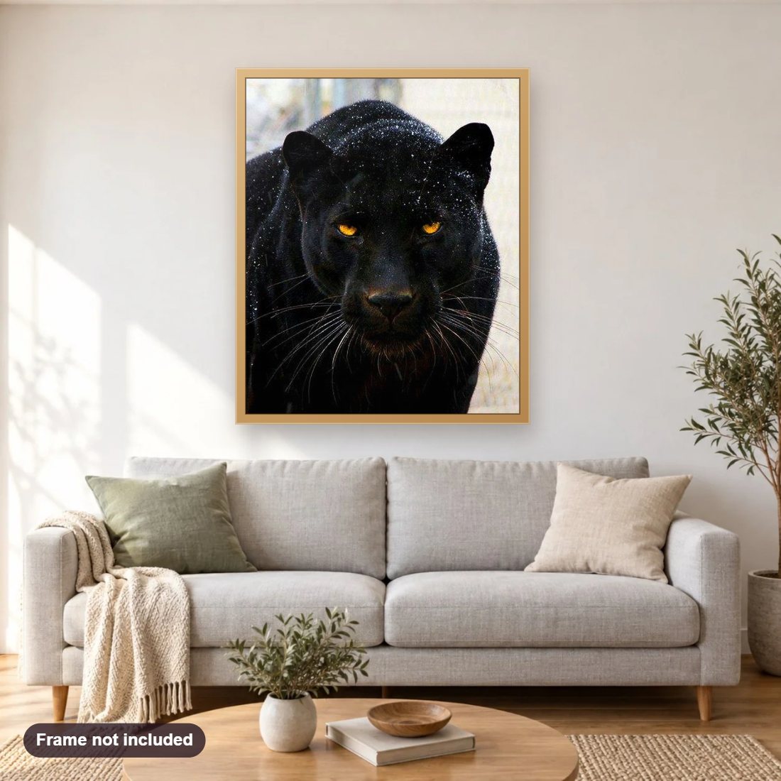 Black Panther diamond painting shown framed on a living room wall above a sofa
