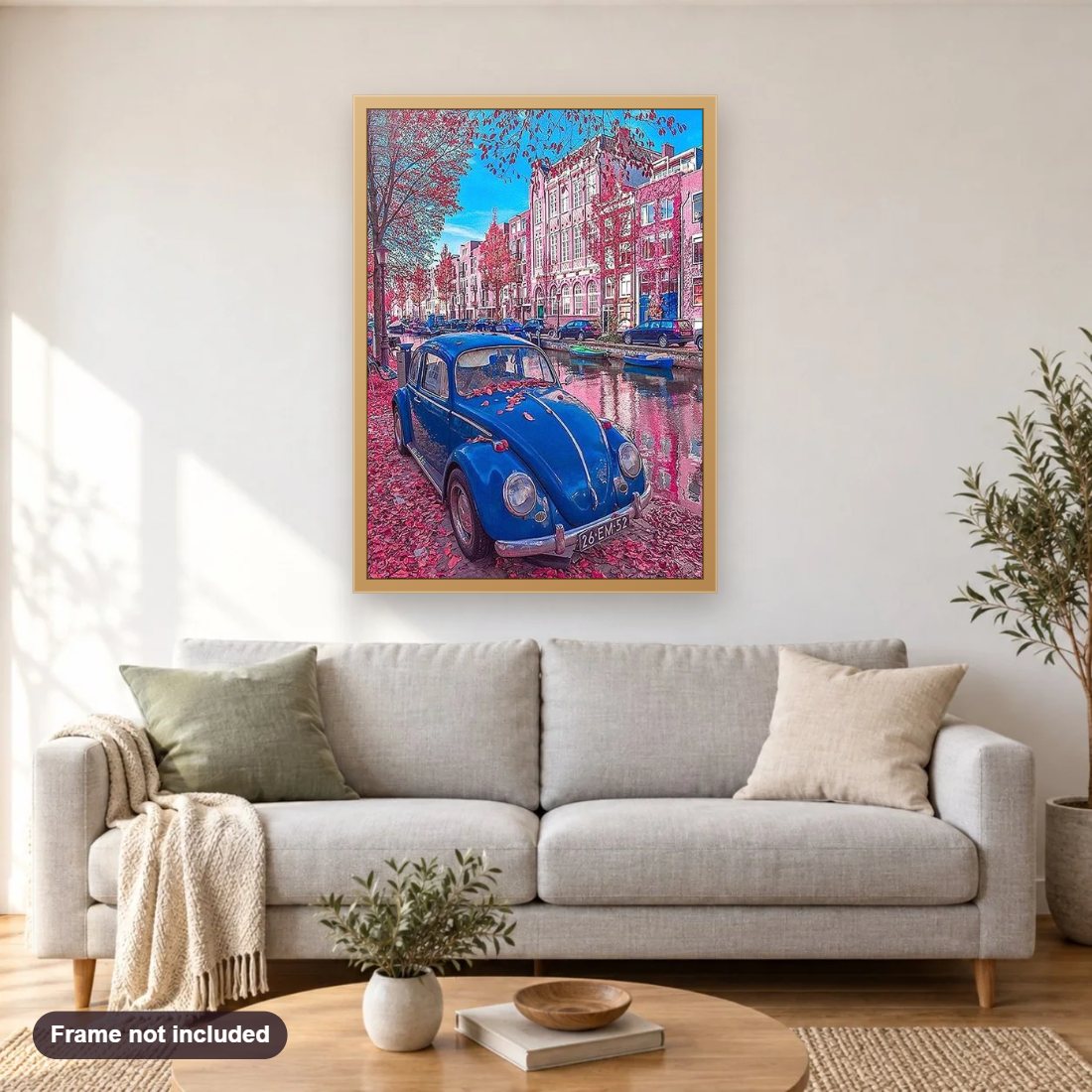 Blue Car & Rain of Pink Flowers diamond painting shown framed on a living room wall above a sofa