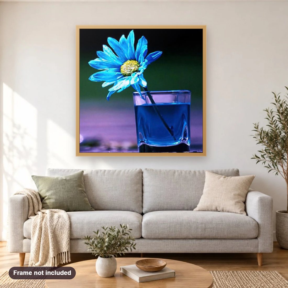 Blue Daisy in Glass diamond painting shown framed on a living room wall above a sofa