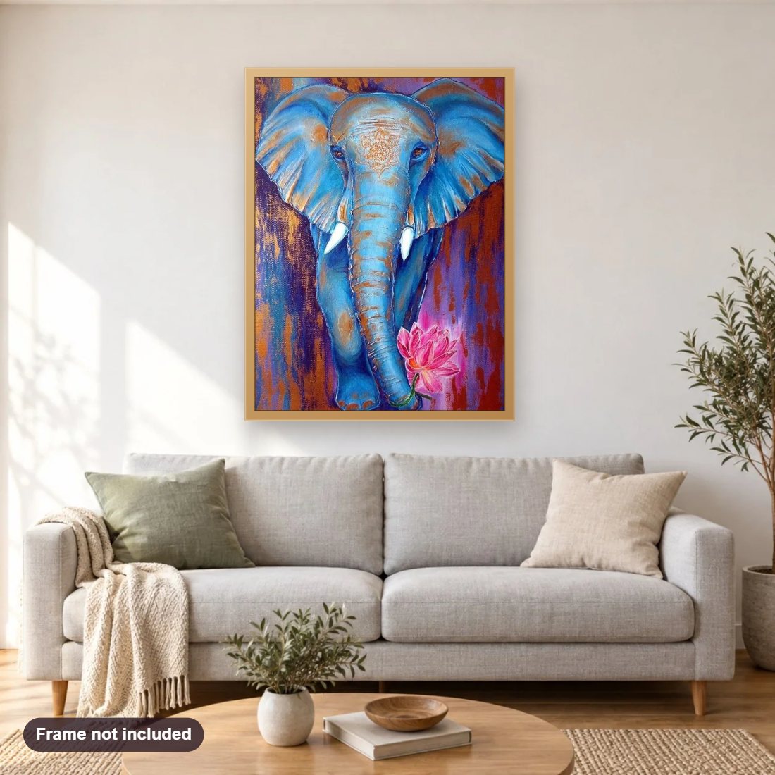 Blue Elephant diamond painting shown framed on a living room wall above a sofa