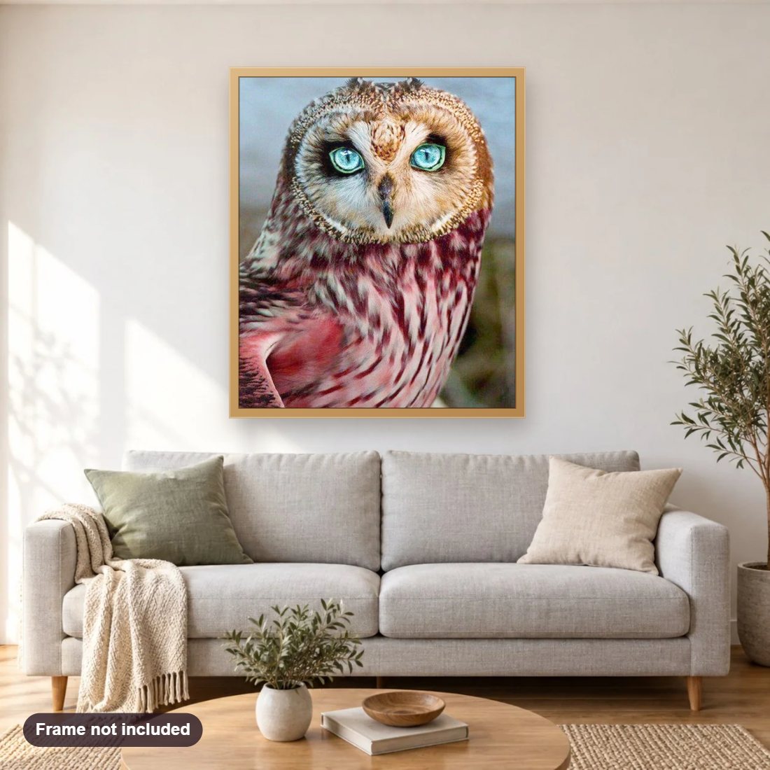 Blue Eyed Owl diamond painting shown framed on a living room wall above a sofa