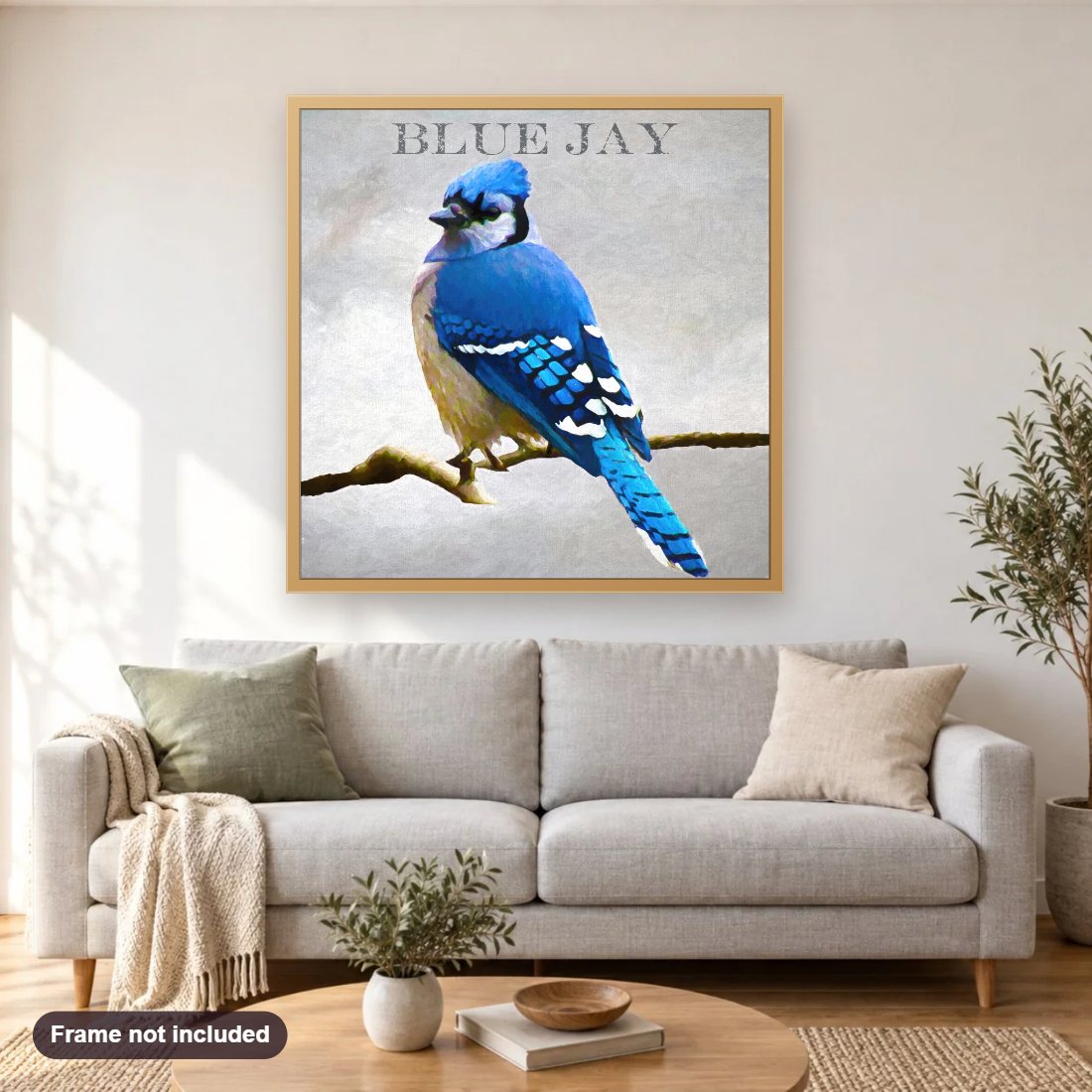 Blue Jay diamond painting shown framed on a living room wall above a sofa