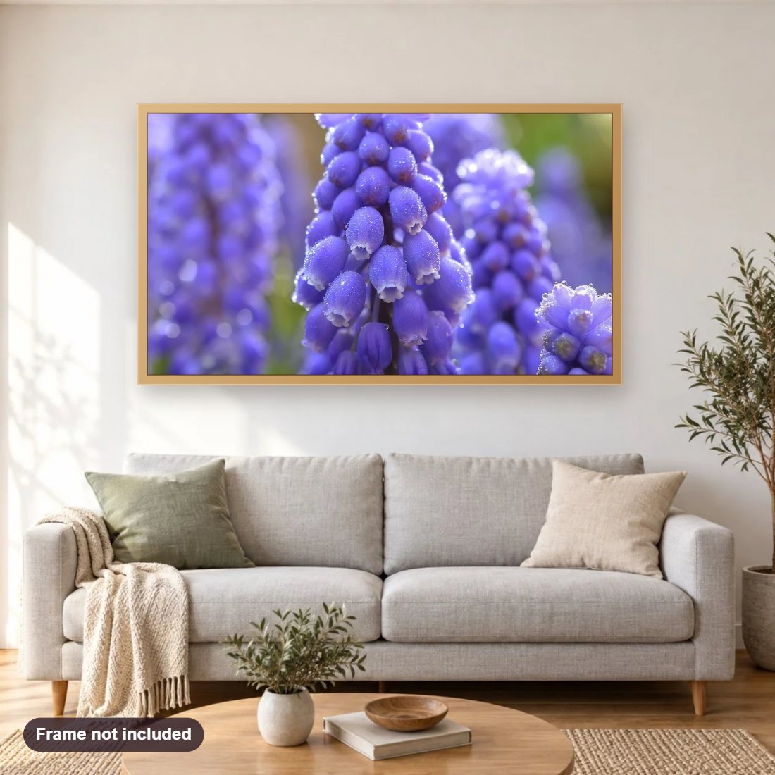 Blue Muscari Flowers diamond painting shown framed on a living room wall above a sofa